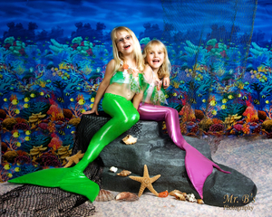 Little girls playing mermaid for photo session